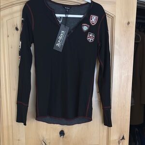 Alp n Rock Fitted Black Long Sleeve Tee with skiers badges.Alpine ski wear.